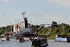 A convoy of narrowboats leaving Eastham Lock on the Manchester Ship Canal – photo: Waterway Images