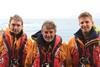 Philip Shannon MBE, flanked by his sons Dan and Jack – Photo: RNLI Tim Stevens