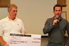 North Sails’ Neil Mackley and Sir Ben Ainslie with the JMST cheque – photo: Richard Langdon, Ocean Images