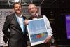 Boatshed's Neil Chapman receives the Chairman's Award from BHG's Paul Martin