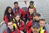 A Teen Marine leader with some of the children the charity supports on board 'Hot Fuzz' Photo: Teen Marine