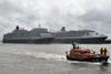 The RNLI’s appropriately named ‘Her Majesty The Queen’ passes the Three Queens line up – photo: Waterway Images