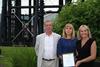 Steve Hart, Clare Collins and Rachel Hodgkinson of BWML collect the award