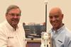 Colin Anderson of Ships Electronic Services accepts the ultrasonic wind sensor on behalf of the Vine Trust from David Ash, Mantsbrite MD